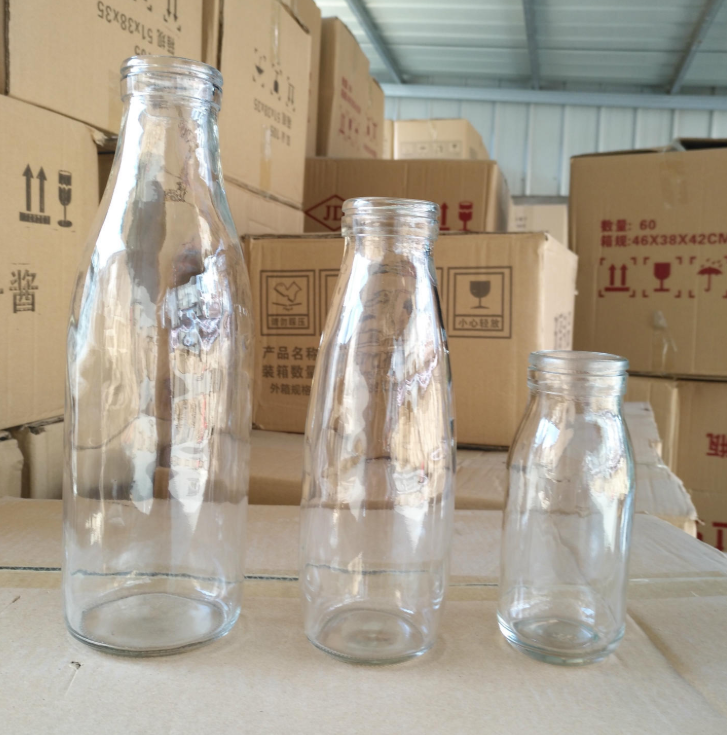 in Stock Round Clear Glass Bottle for Juice Milk - China Beverage