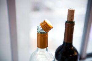 corked liquor bottles and screw-on liquor bottle